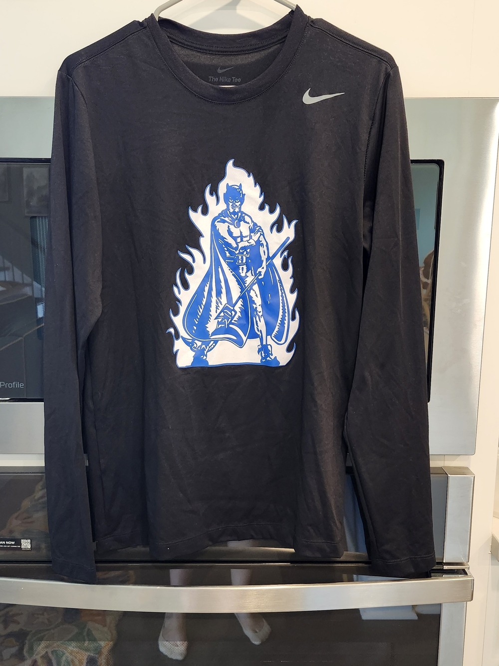 Duke Coach K Academy Nike Black Long-Sleeve Tee with Blue Flame Graphic